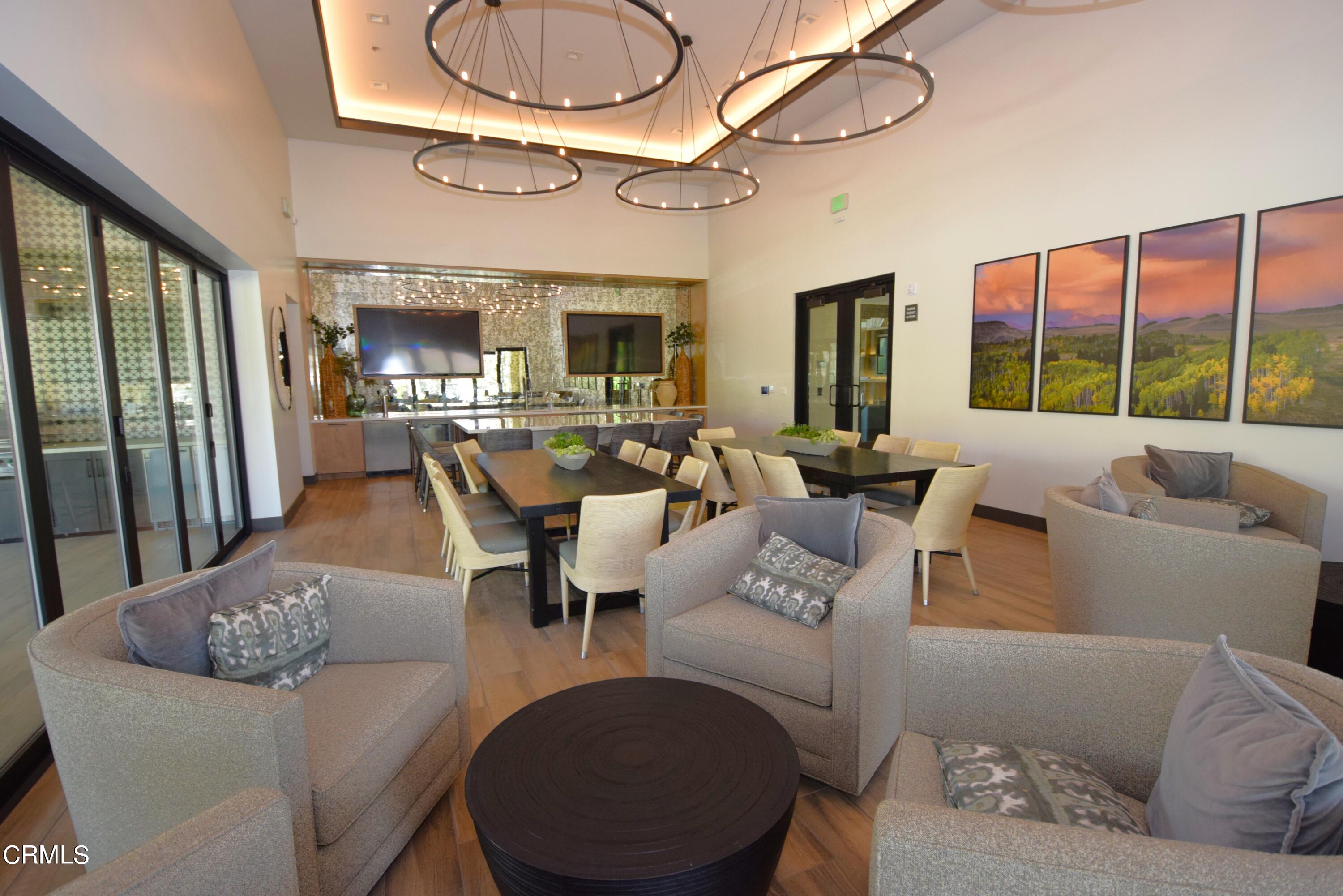 2480 Rondell Road Camarillo, CA 93012 - Photo 48 of 52 a living room with furniture a fireplace and a chandelier