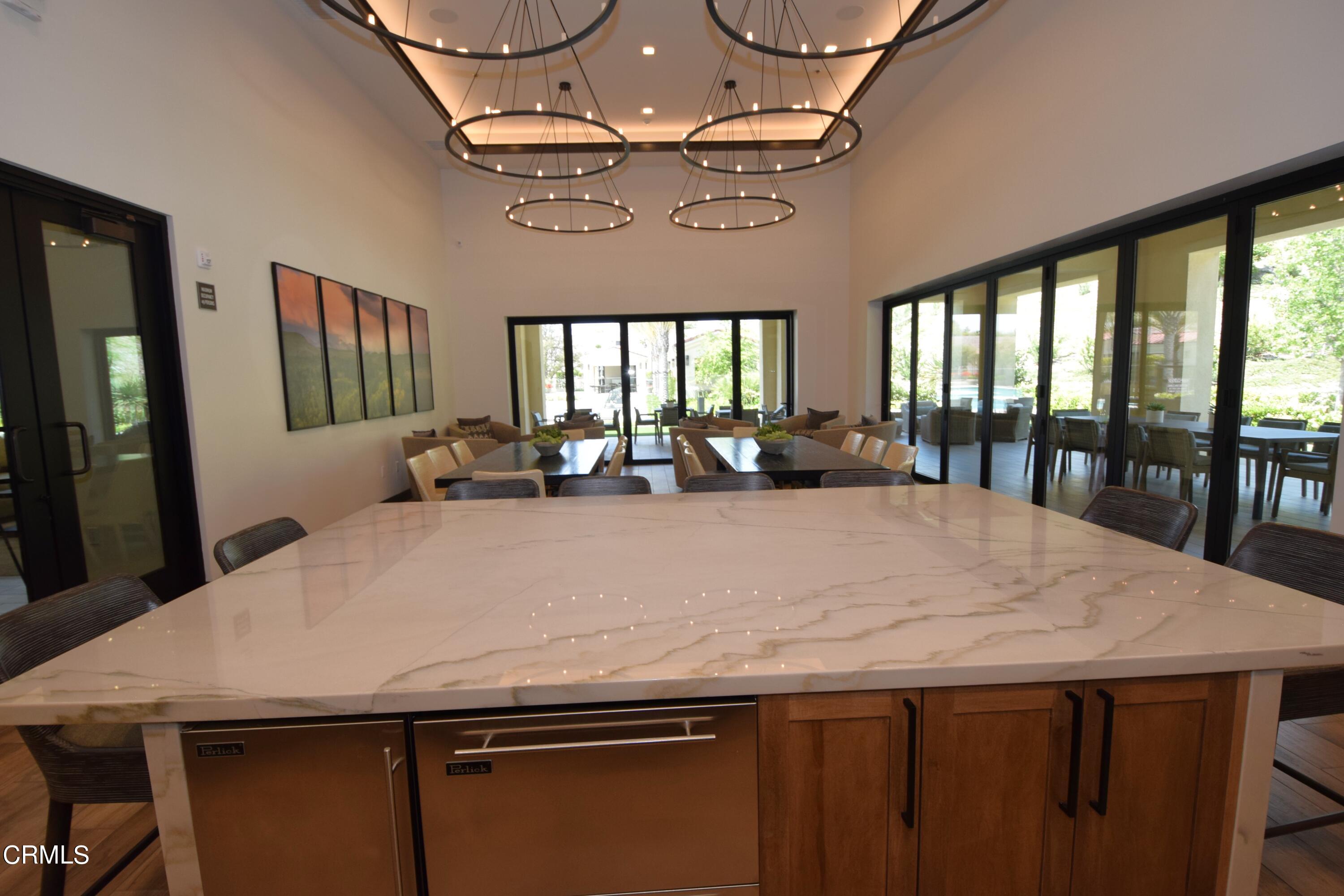 2480 Rondell Road Camarillo, CA 93012 - Photo 50 of 52 a large kitchen with a table chairs and a large window