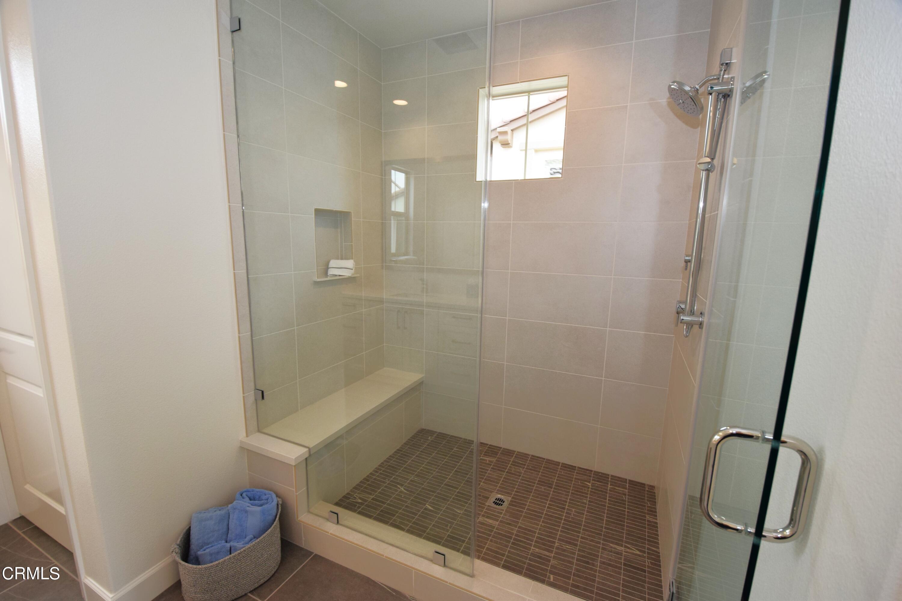 2480 Rondell Road Camarillo, CA 93012 - Photo 5 of 52 a bathroom with a tub shower vanity and a sink
