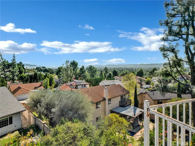 a view of a garden with wooden fence