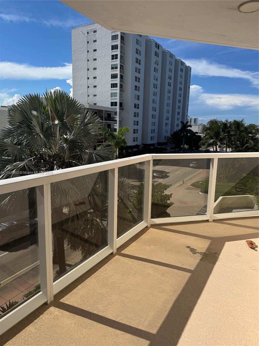 6423 Collins Avenue, Unit 401 Miami Beach, FL 33141 - Photo 16 of 17 a view of balcony with floor to ceiling windows