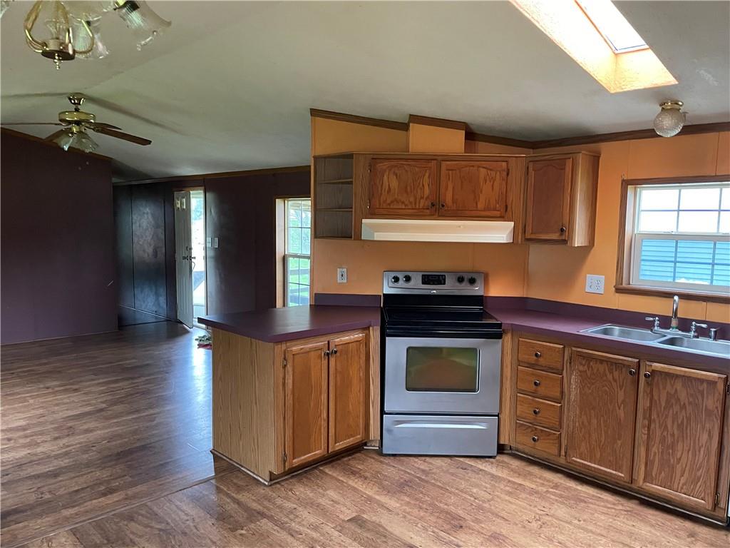 112 Vance Road New Castle, PA 16102 - Photo 3 of 5 a kitchen with stainless steel appliances granite countertop a stove a sink and a microwave