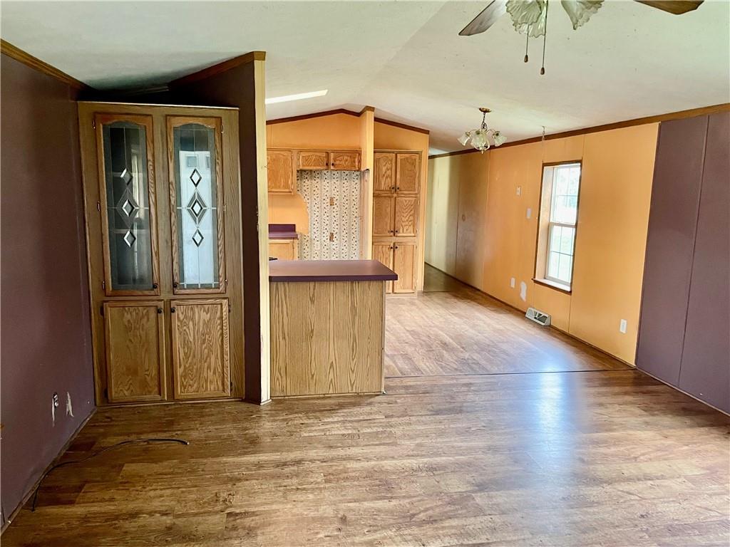 112 Vance Road New Castle, PA 16102 - Photo 5 of 5 an empty room with wooden floor and windows