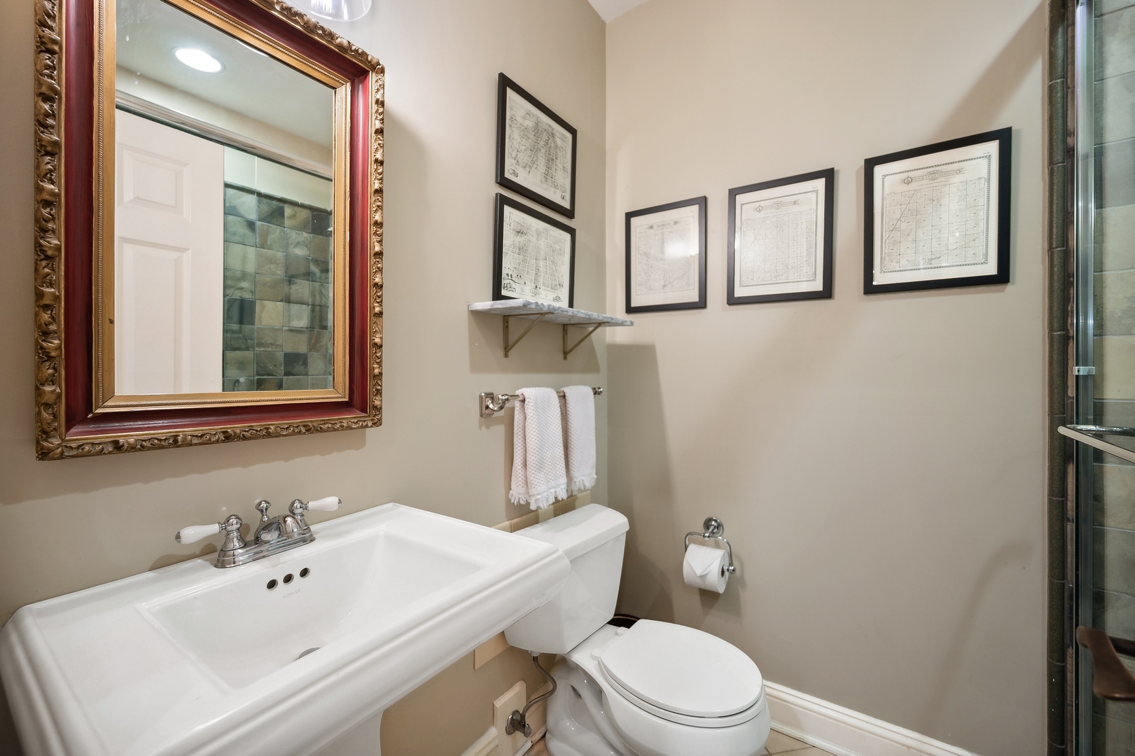 719 Forest Road Glenview, IL 60025 - Photo 31 of 38 a bathroom with a sink mirror and toilet