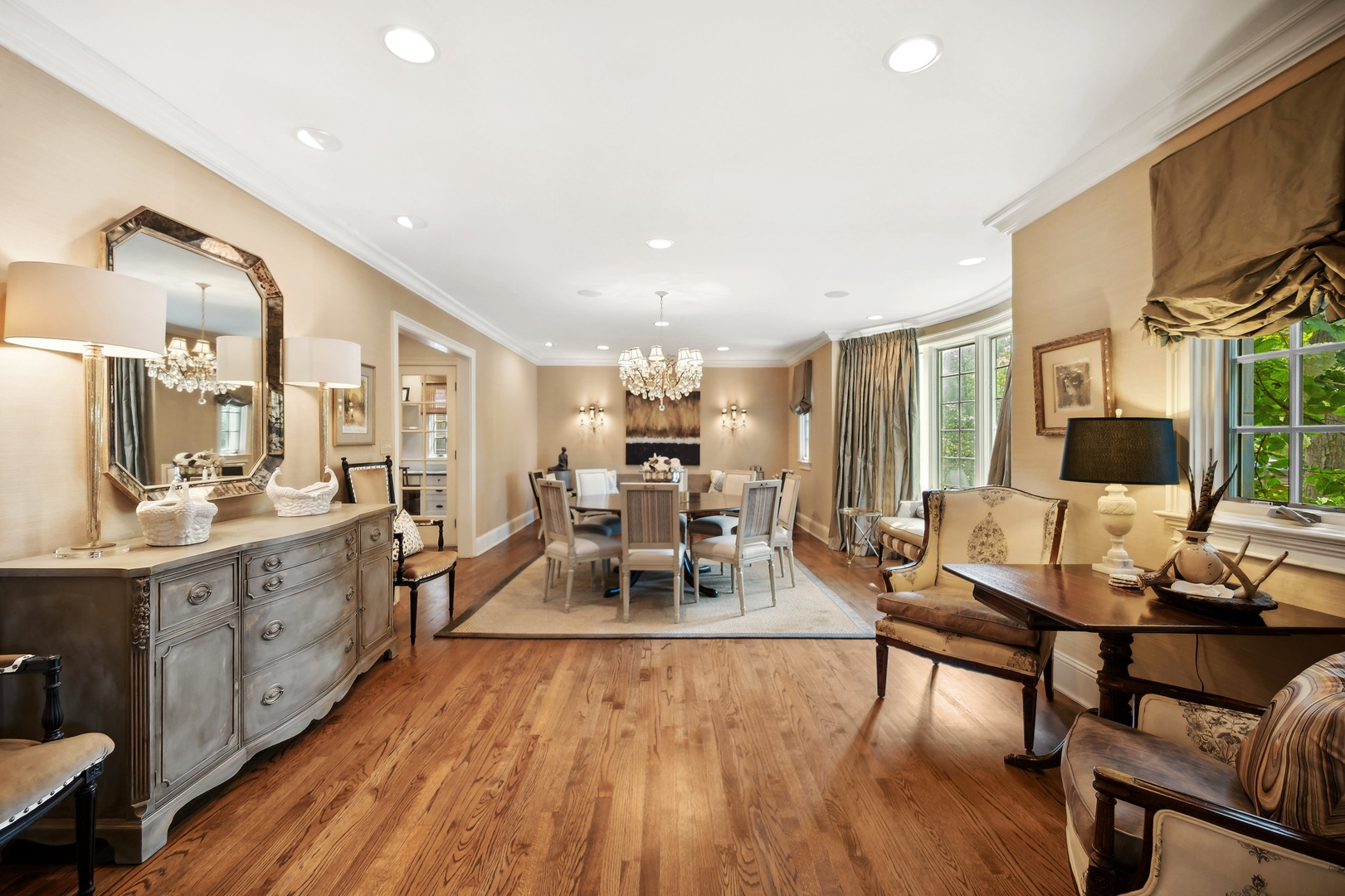 719 Forest Road Glenview, IL 60025 - Photo 5 of 38 a living room with furniture a large window and wooden floors
