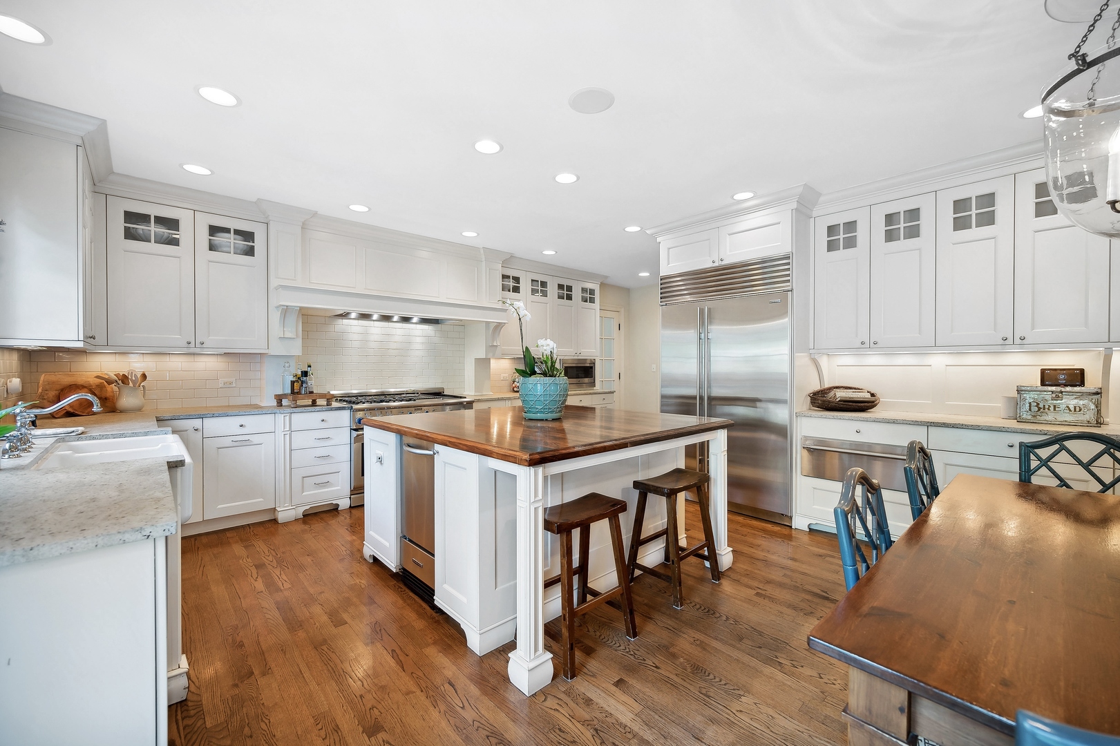 719 Forest Road Glenview, IL 60025 - Photo 9 of 38 a kitchen with appliances a sink and cabinets