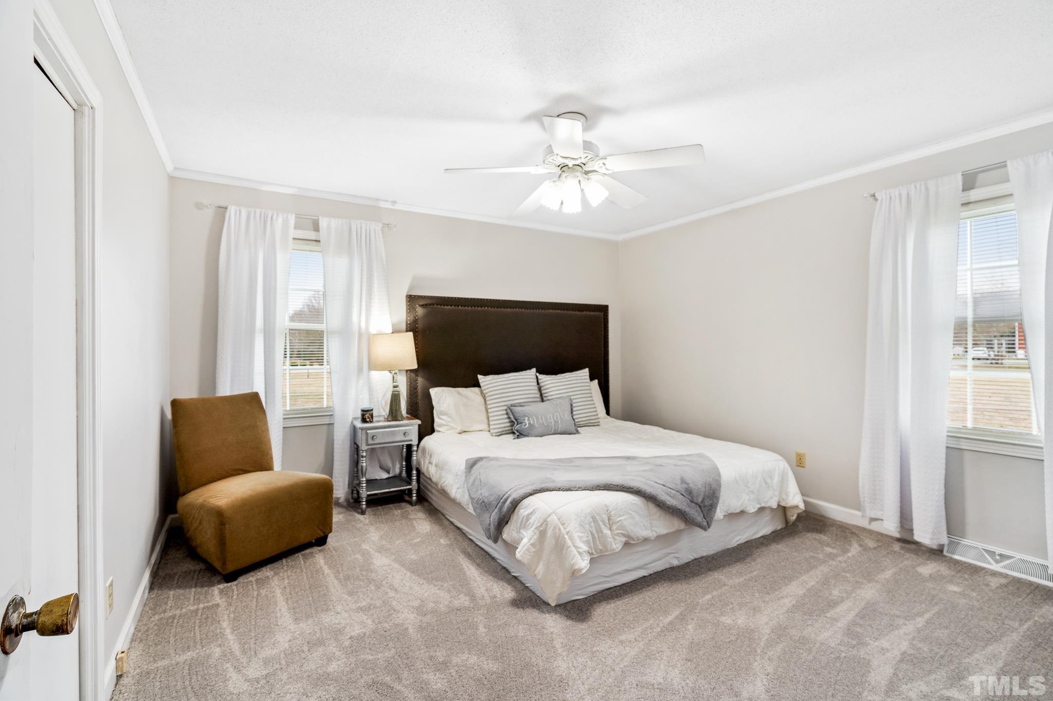 7630 High Rock Road Efland, NC 27243 - Photo 11 of 25 a bedroom with a bed a couch and dresser