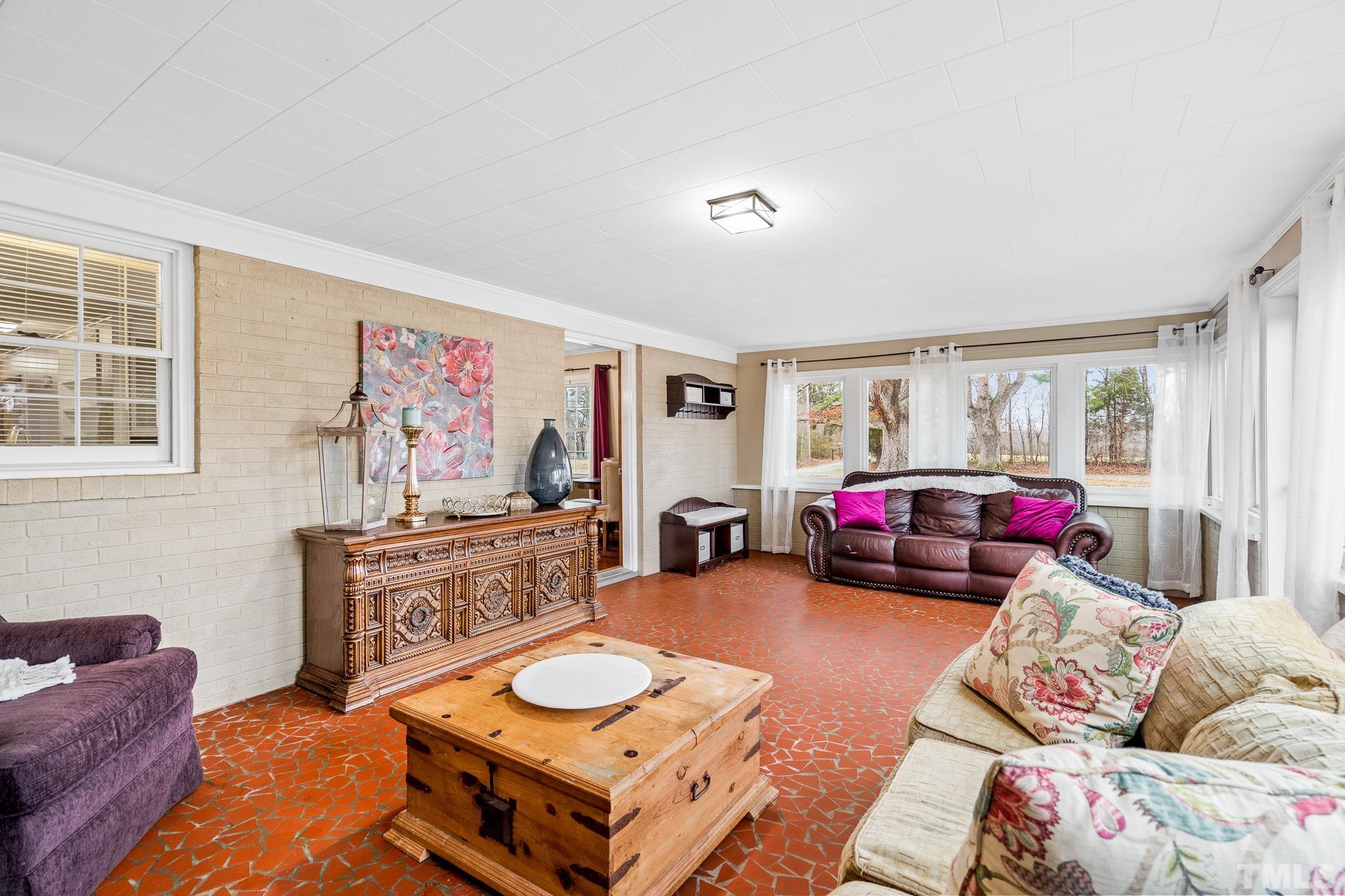 7630 High Rock Road Efland, NC 27243 - Photo 2 of 25 a living room with furniture and a couch