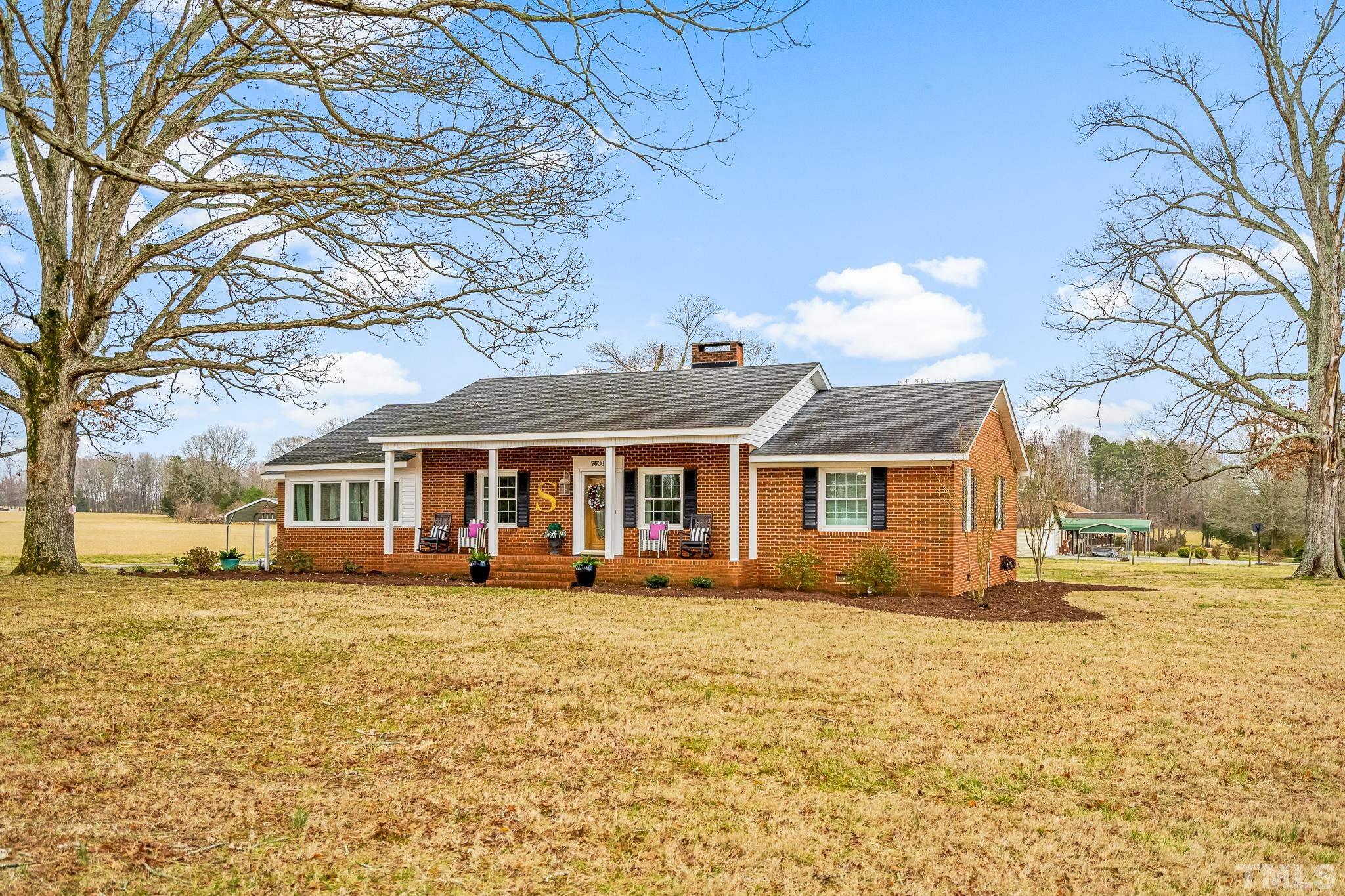 7630 High Rock Road Efland, NC 27243 - Photo 21 of 25 a front view of a house with a yard