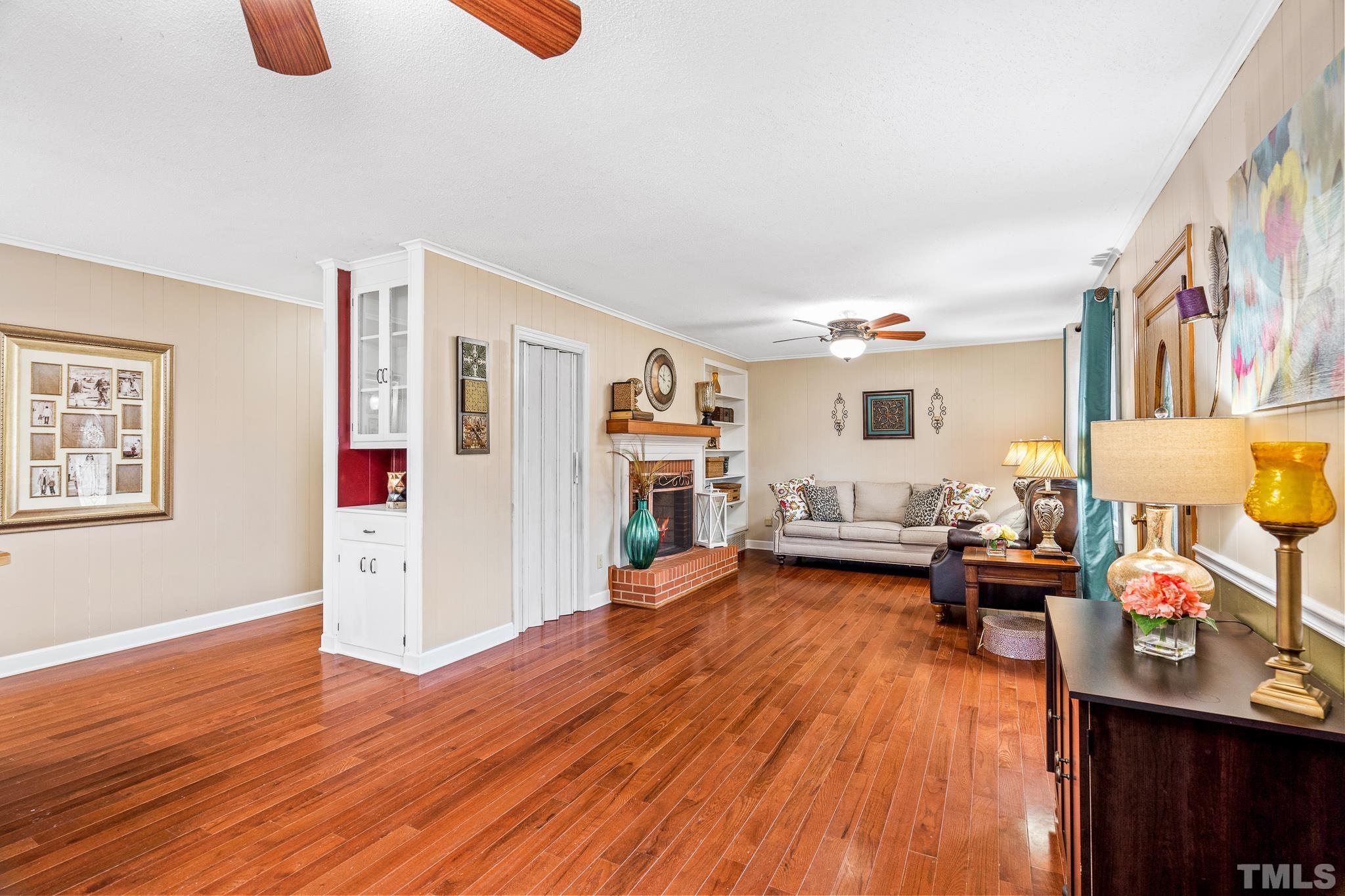 7630 High Rock Road Efland, NC 27243 - Photo 3 of 25 a living room with furniture and wooden floor