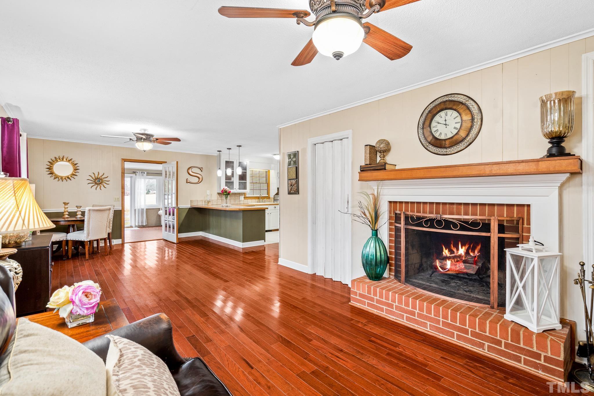 7630 High Rock Road Efland, NC 27243 - Photo 4 of 25 a living room with furniture and a fireplace