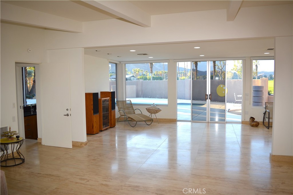 40231 Club View Drive Rancho Mirage, CA 92270 - Photo 15 of 37 a living room with furniture and a large window