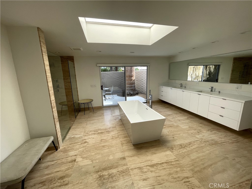 40231 Club View Drive Rancho Mirage, CA 92270 - Photo 16 of 37 a living room with furniture and a flat screen tv