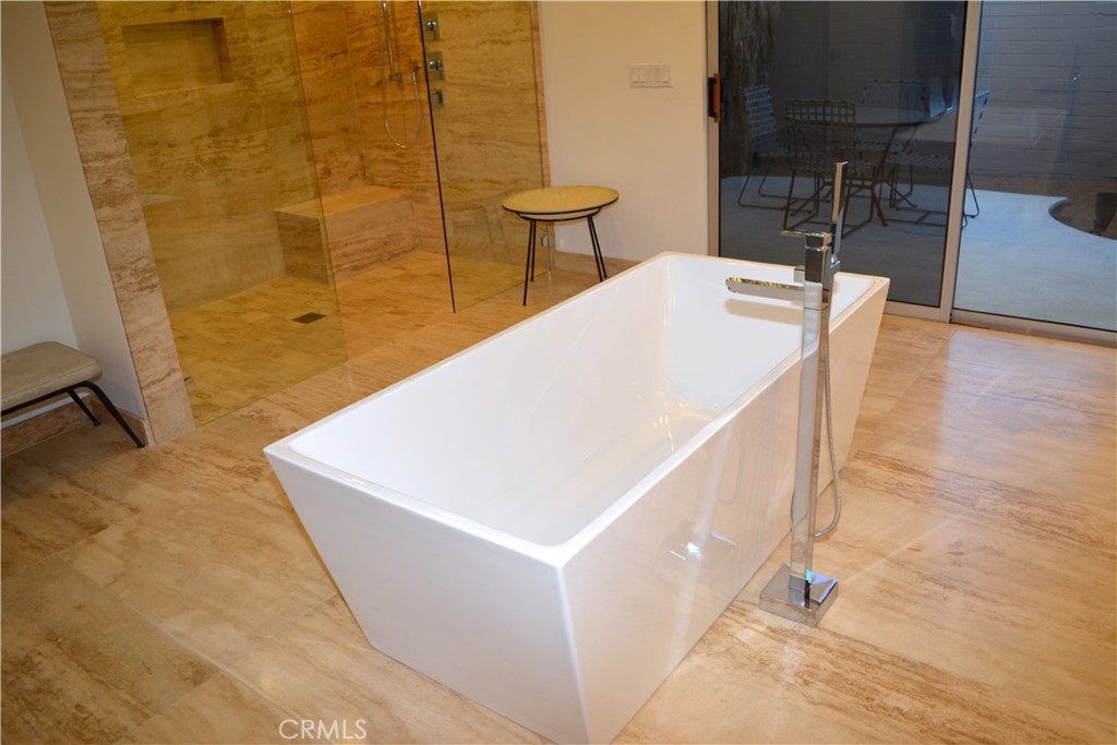 40231 Club View Drive Rancho Mirage, CA 92270 - Photo 19 of 37 a white house with a sink and a mirror