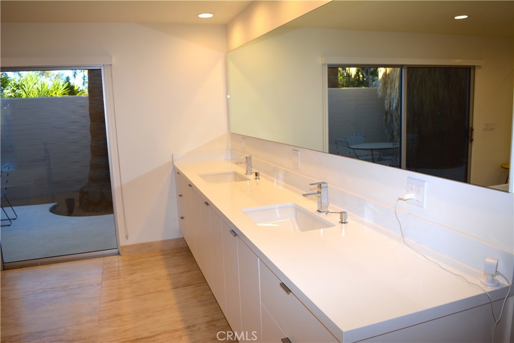 40231 Club View Drive Rancho Mirage, CA 92270 - Photo 22 of 37 a bathroom with a sink and a mirror