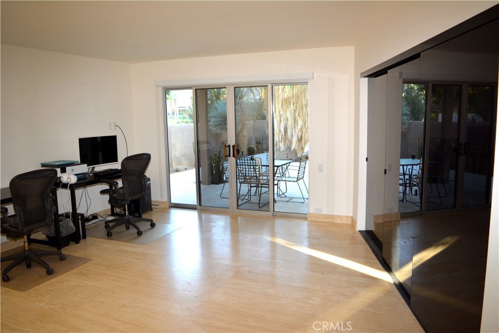 40231 Club View Drive Rancho Mirage, CA 92270 - Photo 23 of 37 a view of a livingroom with lounge chair and a large window