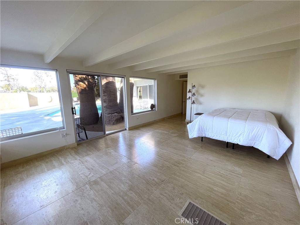 40231 Club View Drive Rancho Mirage, CA 92270 - Photo 25 of 37 a view of a bedroom with window and hardwood floor