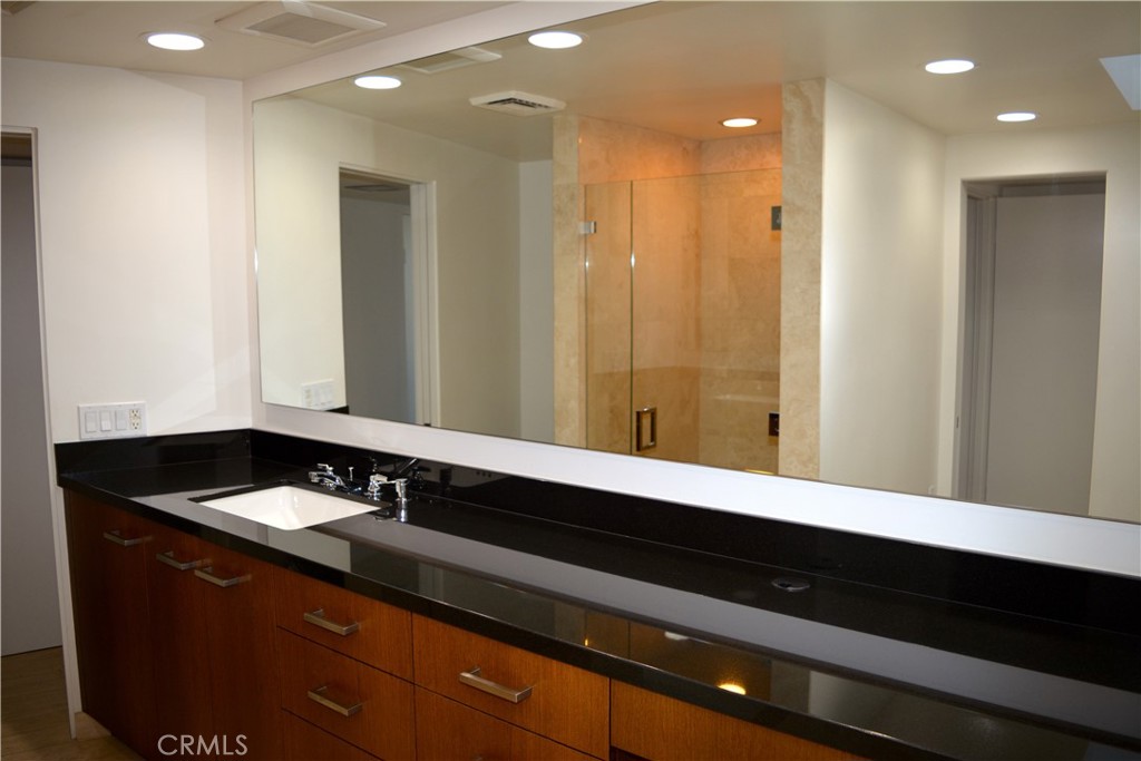 40231 Club View Drive Rancho Mirage, CA 92270 - Photo 30 of 37 a bathroom with a sink and a mirror