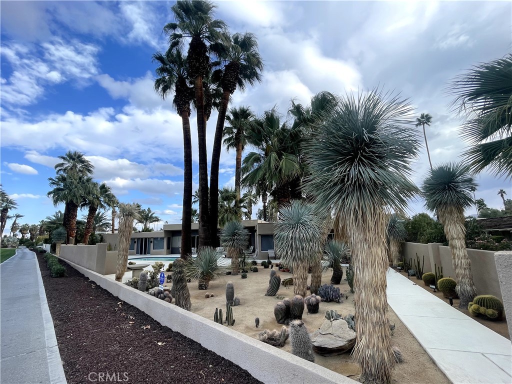 40231 Club View Drive Rancho Mirage, CA 92270 - Photo 3 of 37 a view of swimming pool with a table and chairs