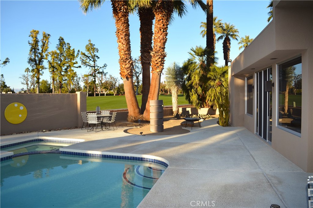 40231 Club View Drive Rancho Mirage, CA 92270 - Photo 31 of 37 a view of a house with swimming pool and sitting area