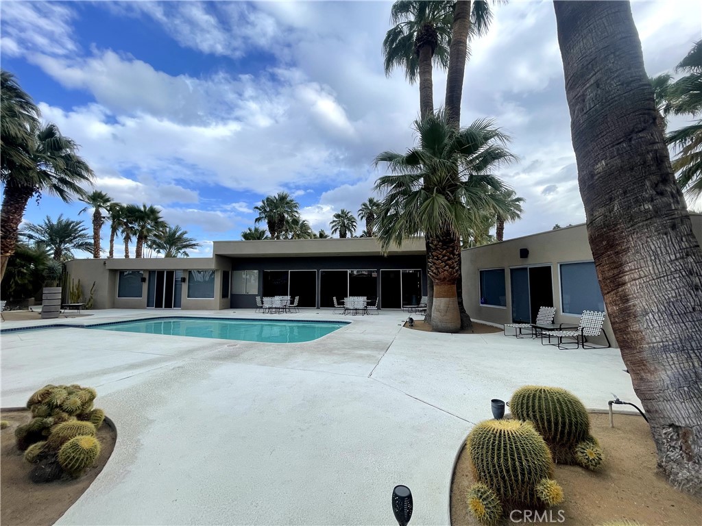 40231 Club View Drive Rancho Mirage, CA 92270 - Photo 35 of 37 a house with palm tree in front of it