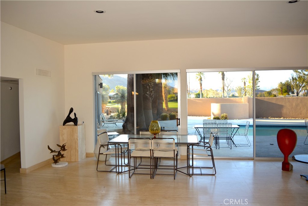 40231 Club View Drive Rancho Mirage, CA 92270 - Photo 7 of 37 a living room with furniture and a large window