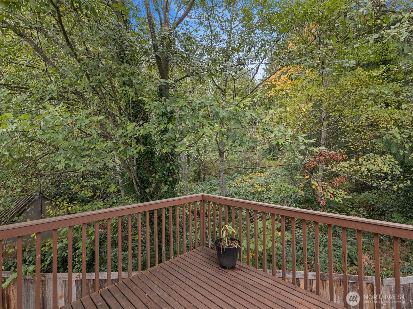 5411 158th Place Southwest Edmonds, WA 98026 - Photo 13 of 38 a balcony with wooden floor and trees