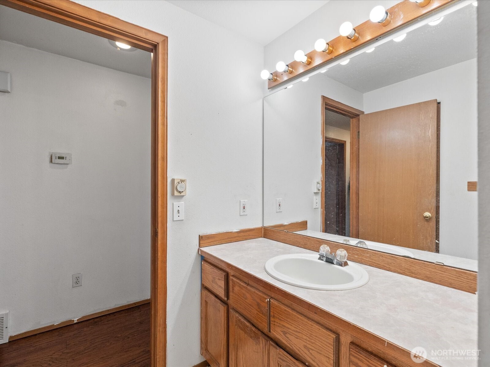 5411 158th Place Southwest Edmonds, WA 98026 - Photo 18 of 38 a bathroom with a sink and a mirror