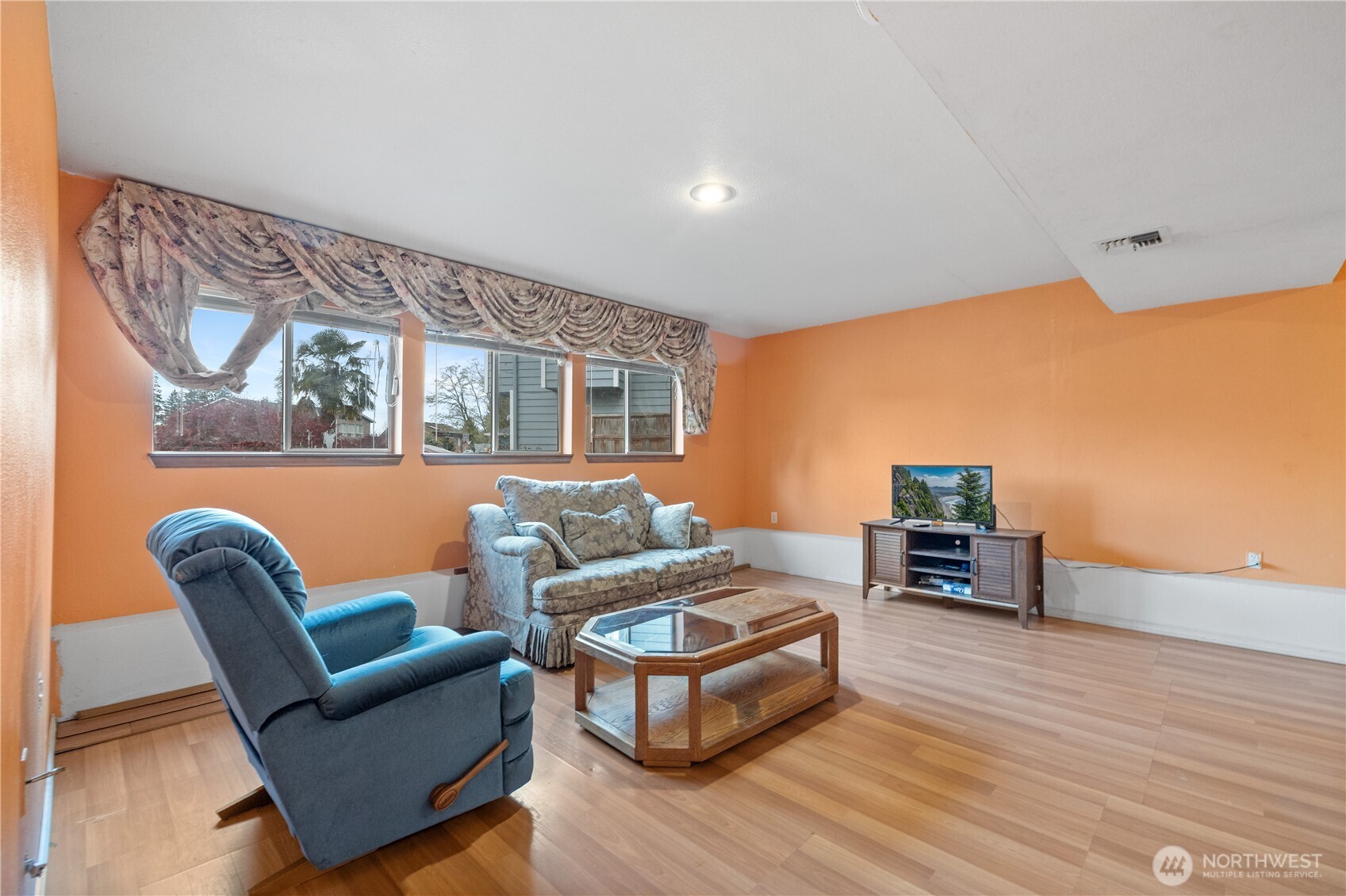 5411 158th Place Southwest Edmonds, WA 98026 - Photo 24 of 38 a living room with furniture and a wooden floor