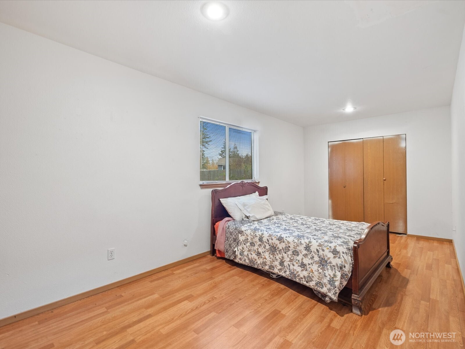 5411 158th Place Southwest Edmonds, WA 98026 - Photo 26 of 38 a bedroom with a bed and wooden floor
