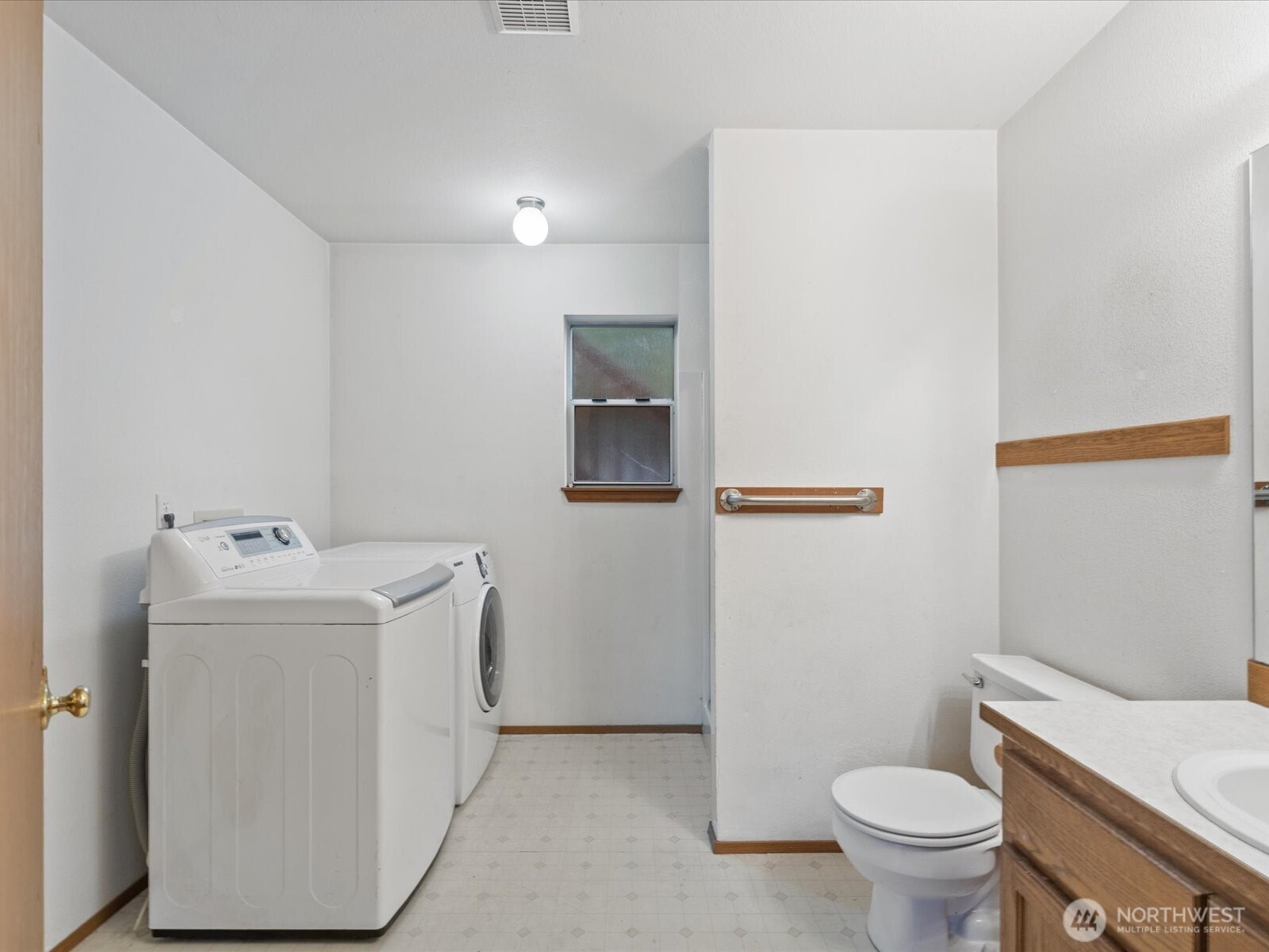 5411 158th Place Southwest Edmonds, WA 98026 - Photo 28 of 38 a view of bathroom with a sink toilet and mirror