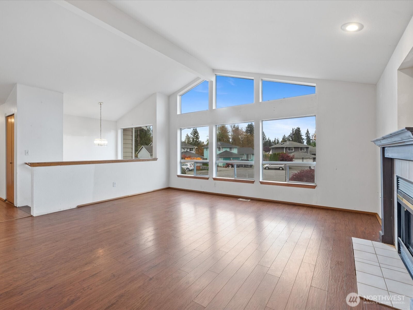 5411 158th Place Southwest Edmonds, WA 98026 - Photo 5 of 38 an empty room with wooden floor and windows