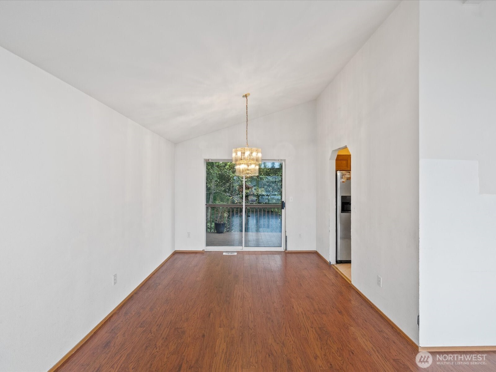 5411 158th Place Southwest Edmonds, WA 98026 - Photo 9 of 38 an empty room with wooden floor and windows
