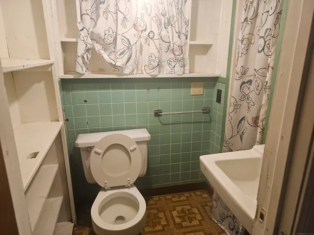 a bathroom with a toilet and a sink