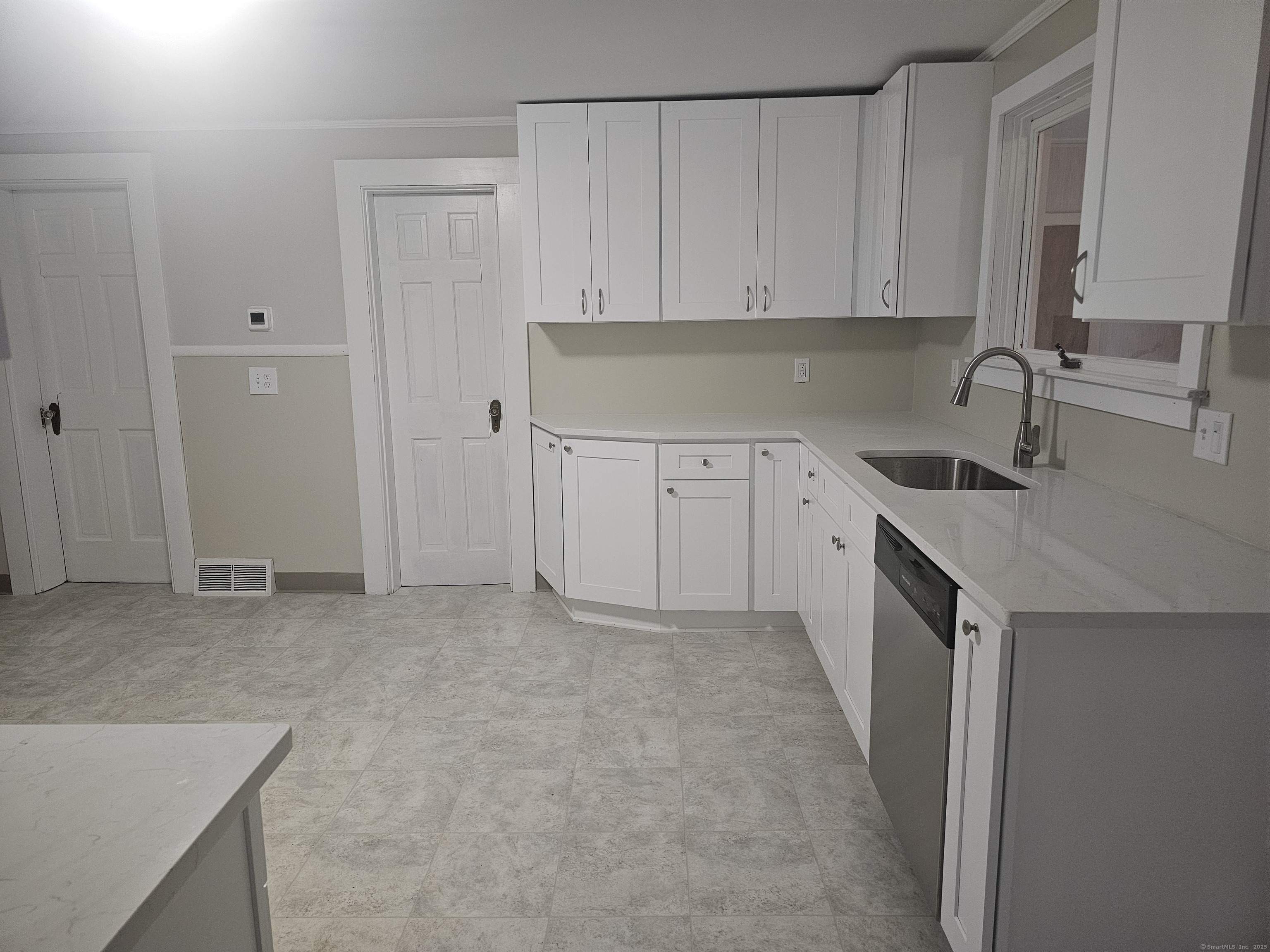 8 Cliff Street Naugatuck, CT 06770 - Photo 3 of 16 a kitchen with granite countertop a sink and cabinets