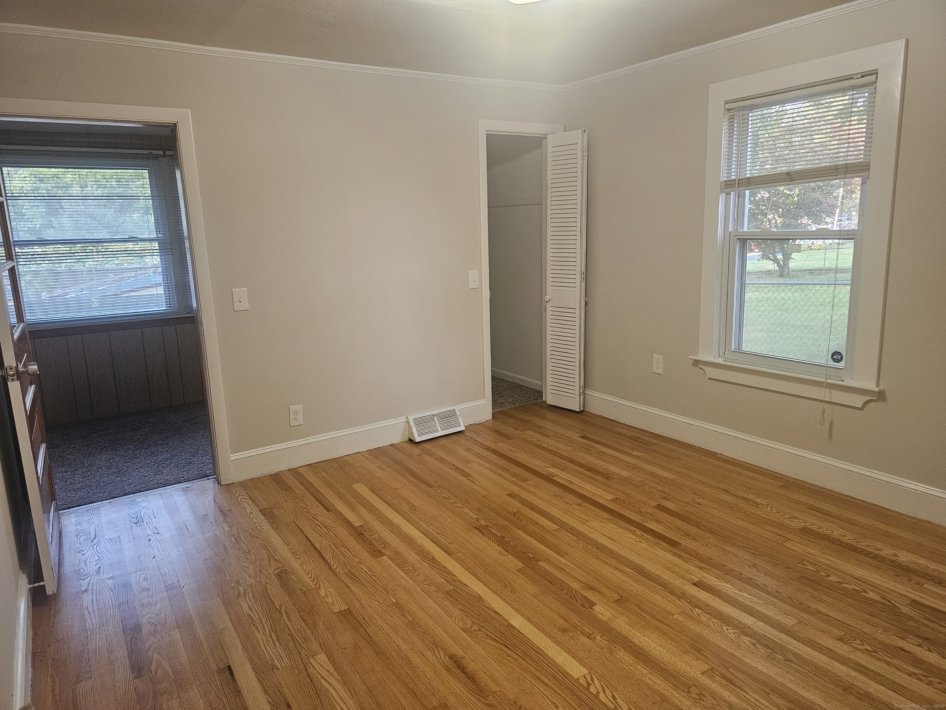 8 Cliff Street Naugatuck, CT 06770 - Photo 7 of 16 an empty room with wooden floor and windows