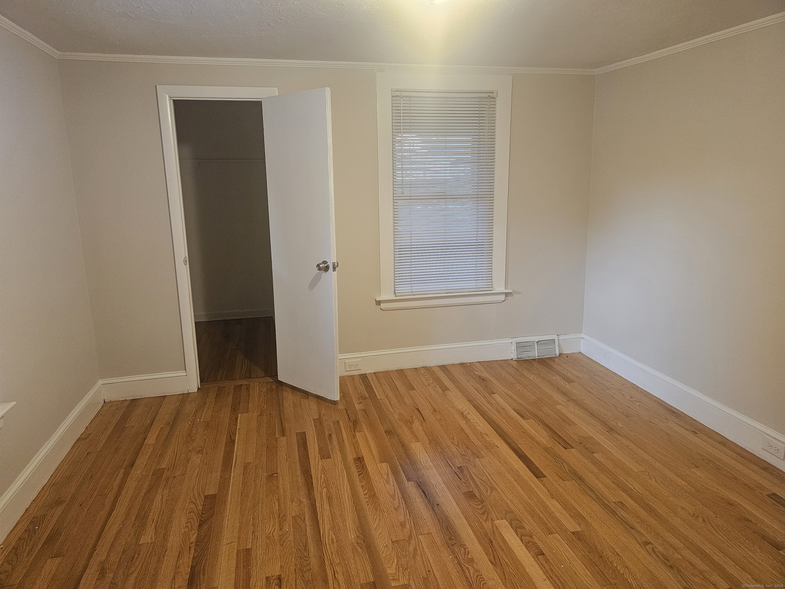 8 Cliff Street Naugatuck, CT 06770 - Photo 10 of 16 an empty room with wooden floor and windows