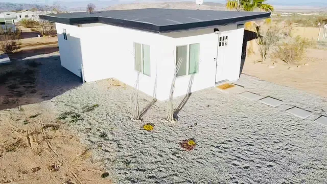 a view of a backyard of a house