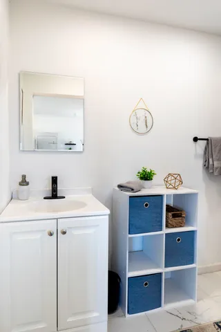 a room with a table and a mirror