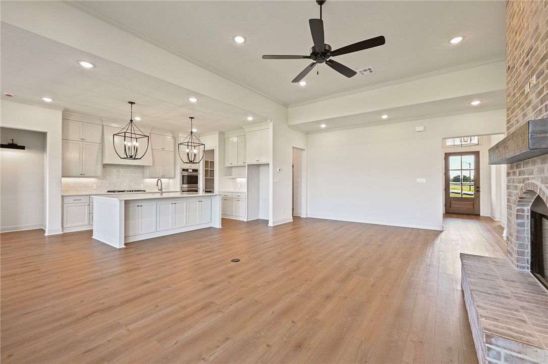 7052 Skipping Rock Path Bryan, TX 77808 - Photo 5 of 23 a view of kitchen with cabinets and wooden floor