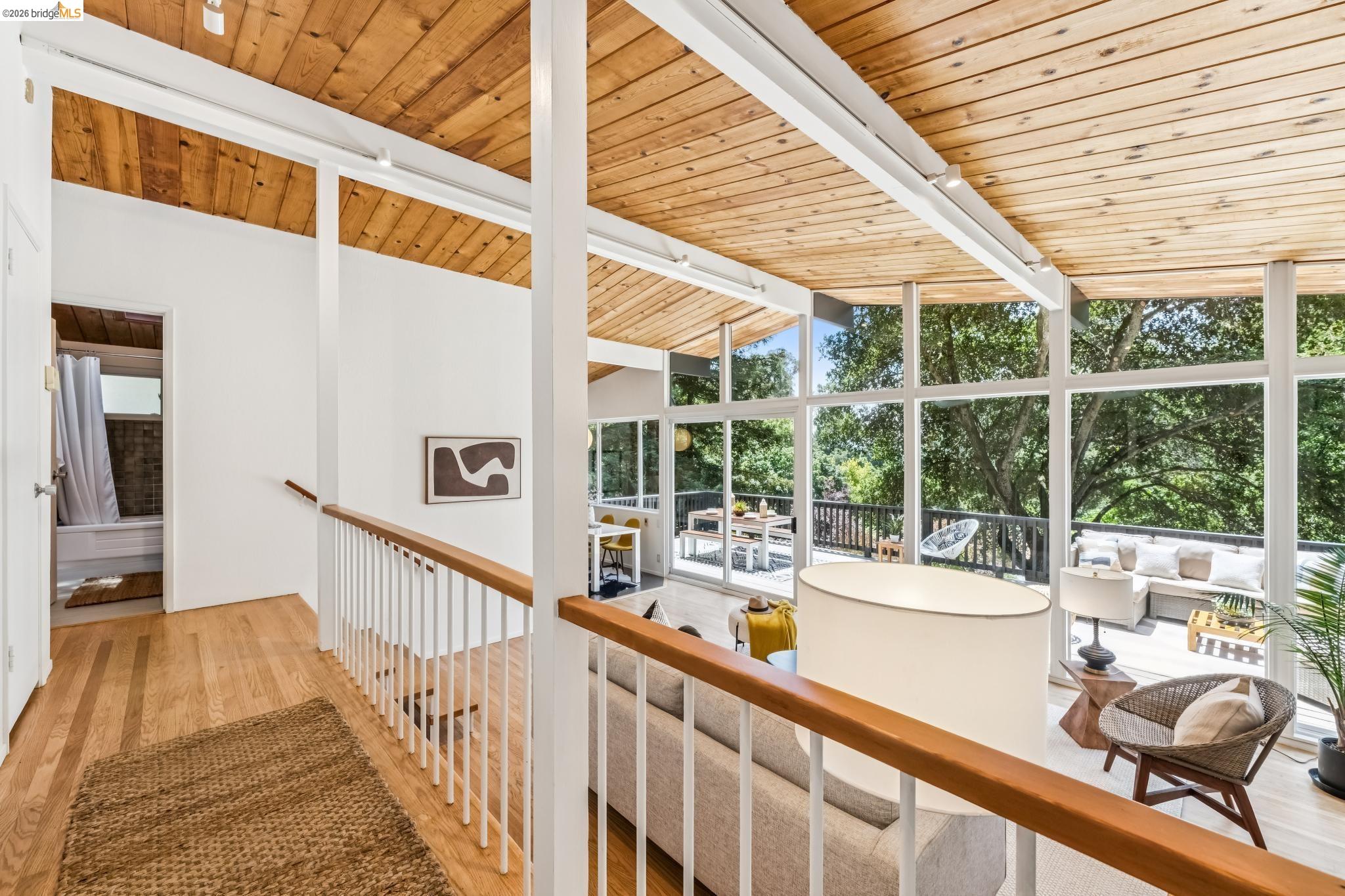 6645 Heather Ridge Way Oakland, CA 94611 - Photo 13 of 61 Expansive wall of windows with abundant natural light and exterior tree scenery