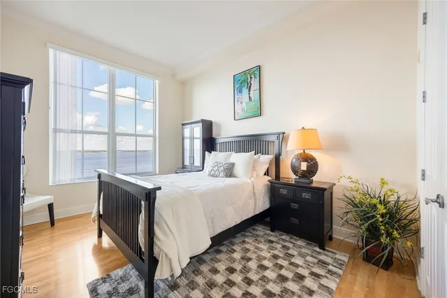 a bed room with a bed and a window