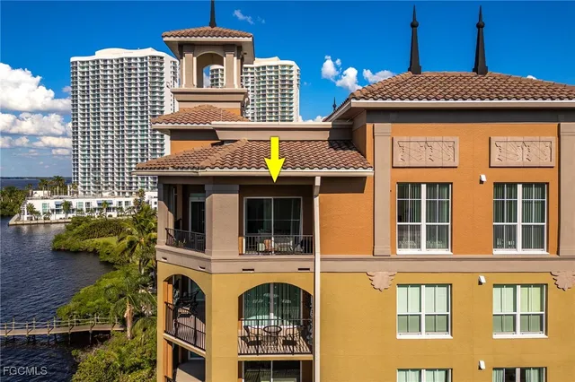 a front view of a residential apartment building with a yard