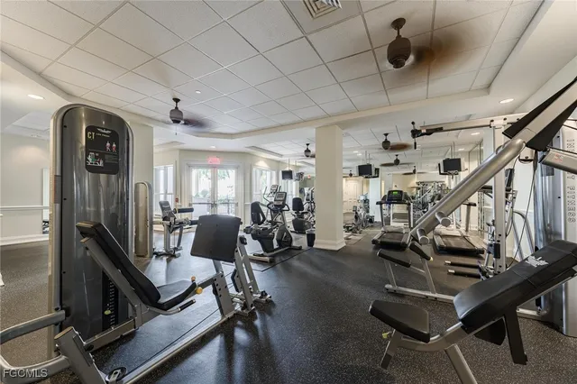 a room with gym equipment and a table