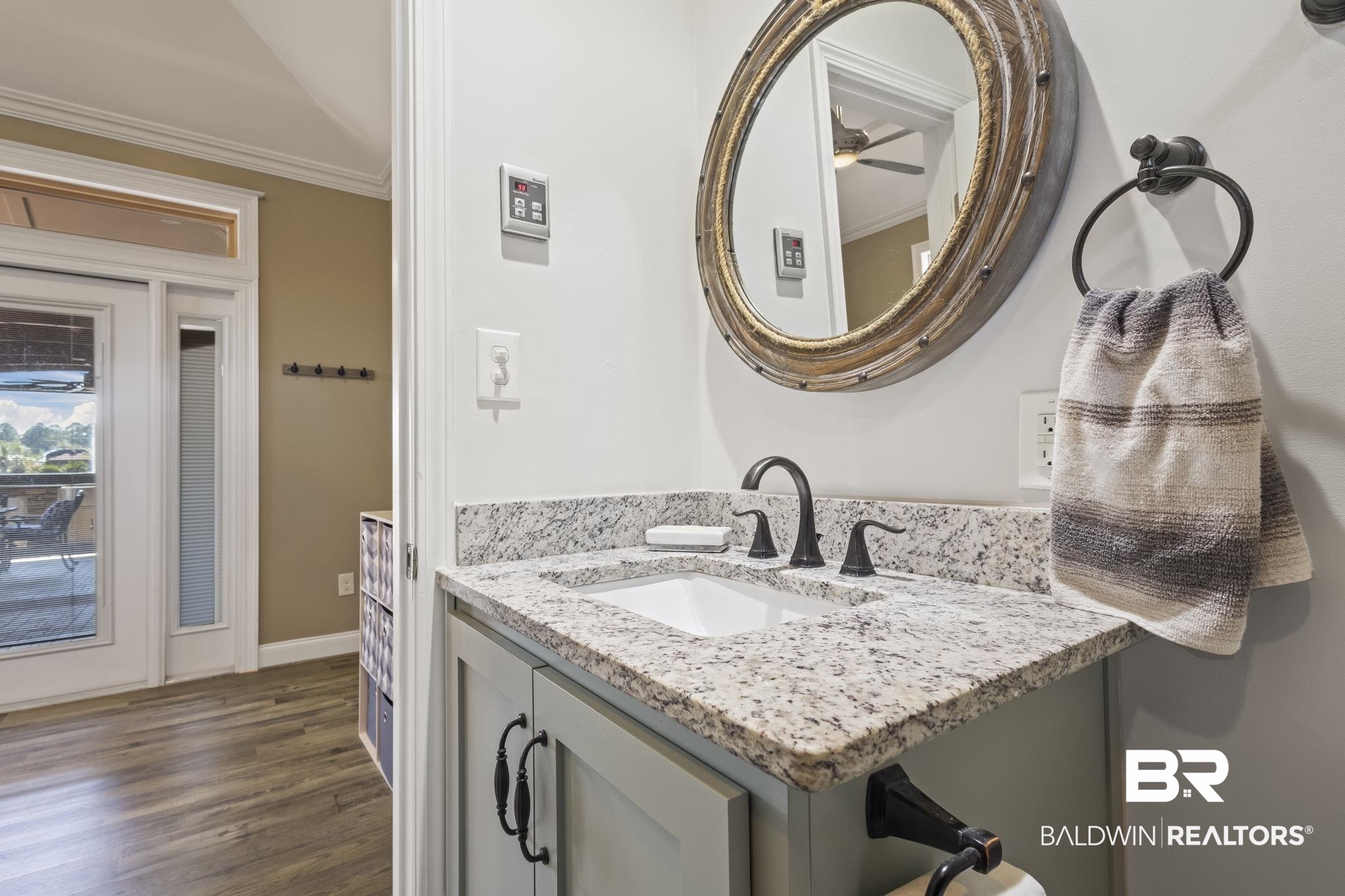 212 Magnifico Drive Foley, AL 36535 - Photo 29 of 50 Bathroom featuring ornamental molding, hardwood / wood-style flooring, and vanity