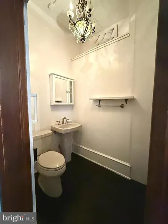 a bathroom with a toilet and a sink