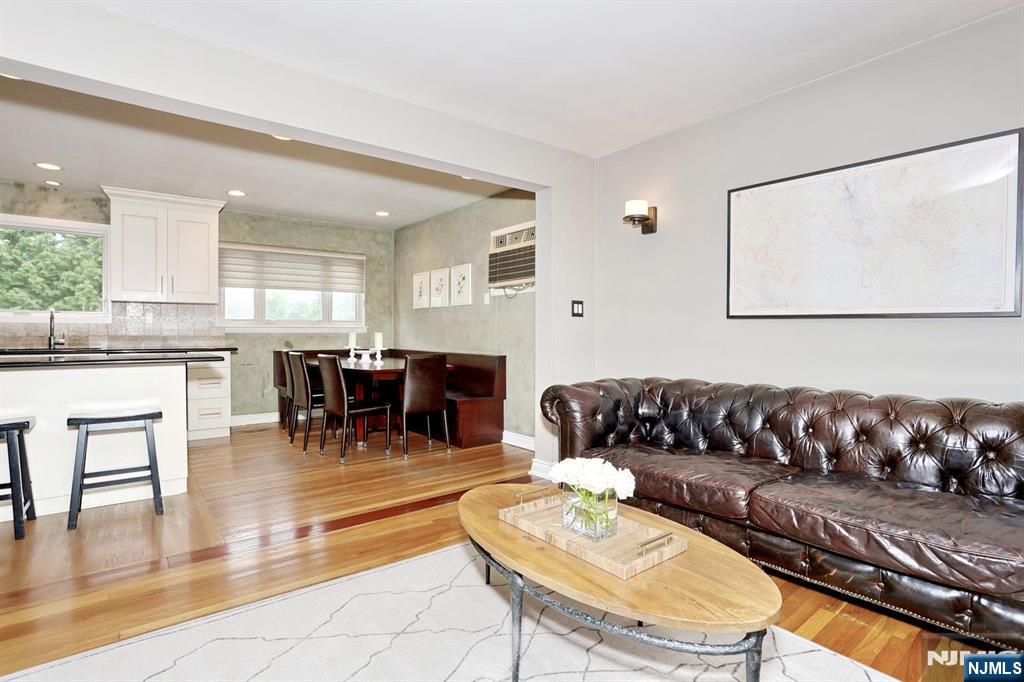 87 Barbara Road Dumont, NJ 07628 - Photo 12 of 48 a living room with furniture and kitchen view