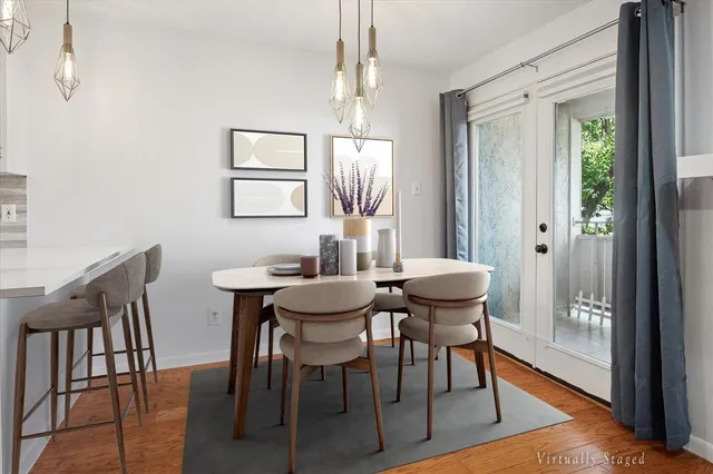 a view of a dining room with furniture window and wooden floor