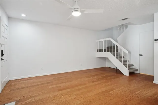 a view of an entryway with wooden floor