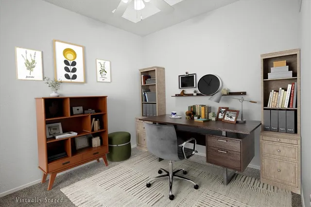 a view of a workspace with furniture